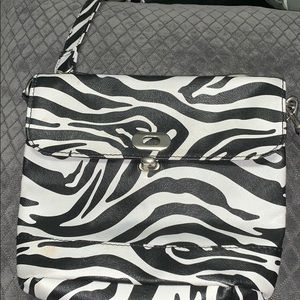 A zebra print cross bag